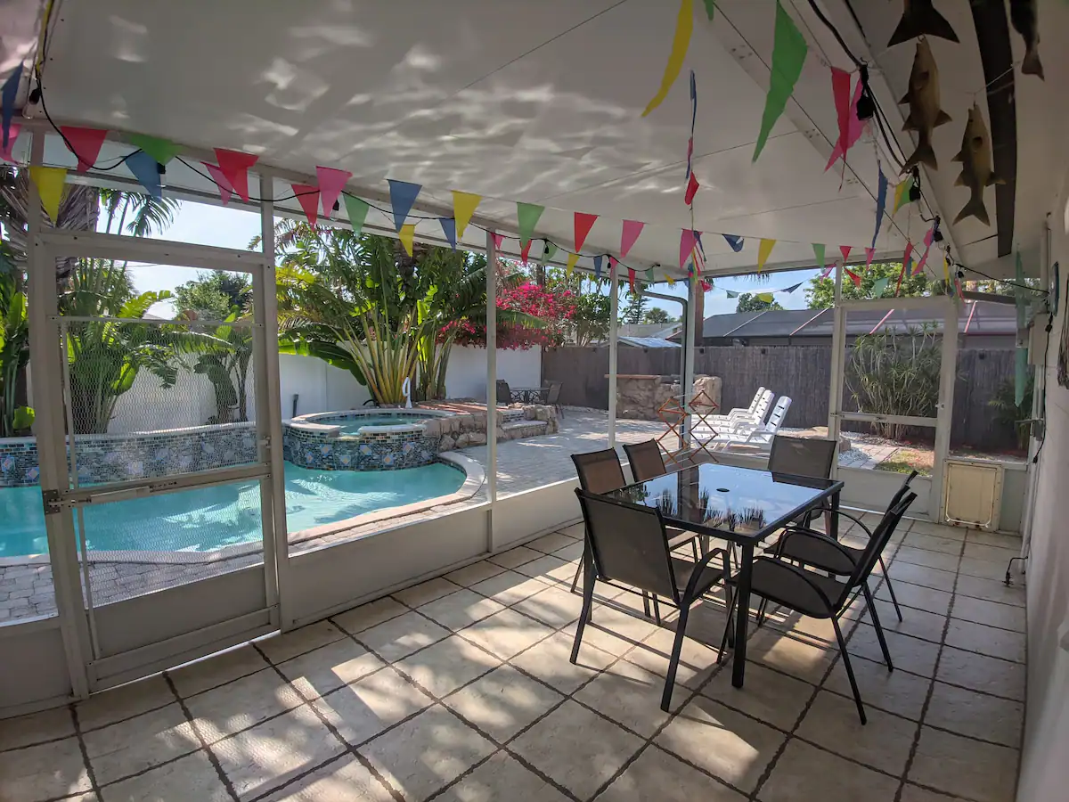 Screened lanai with outdoor dining space